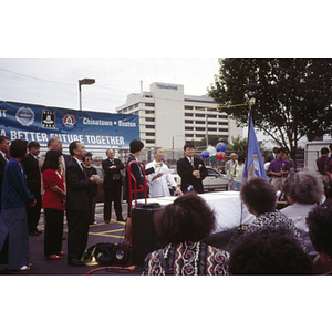 Speaker addresses assembled protestors at their victory ceremony