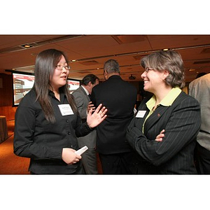 Qinrui Pang converses with Elizabeth Hill at a Torch Scholars event