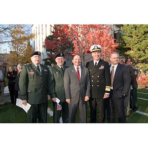 Five men pose together at the Veterans Memorial dedication ceremony