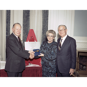 President Ryder shakes hands with the Barnetts at the dedication of the Barnett Institute of Chemical Analysis and Materials Science