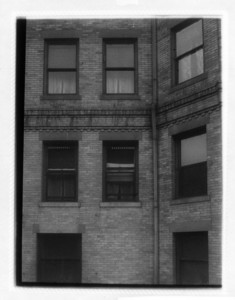 Views of three floors of windows, including a drainpipe, probably Hotel Somerset