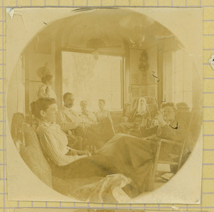 Group portrait of the Tucker family seated indoors