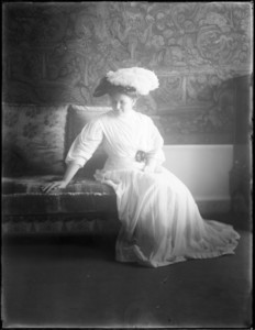 Margaret Curtis seated on settee