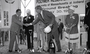 Ceremonial groundbreaking: group including Gov. William Weld (center) shaking hands with unidentified man, Stanley Rosenberg to Weld's right and Corinne Conte to his left