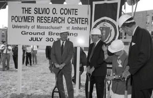 Ceremonial groundbreaking for the Conte Center: Gov. William Weld, UMass Amherst Provost Richard O'Brien, Corrine Conte, and unidentified man preparing for ceremonial first shovel