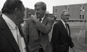 Ceremonial groundbreaking for the Conte Center: unidentified man, Gov. William Weld, and or Richard O'Brien walking to the site of groundbreaking