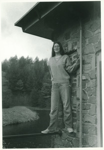 Lisa Lipshires, posed on a railing