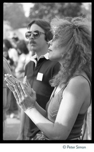 Joni Mitchell applauding at the No Nukes protest and concert