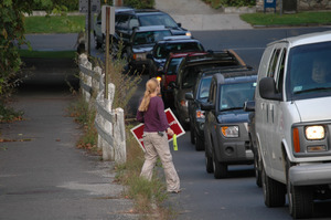 Protest against a pornographic video store in Northampton: protester handing out fliers to cars on North Street