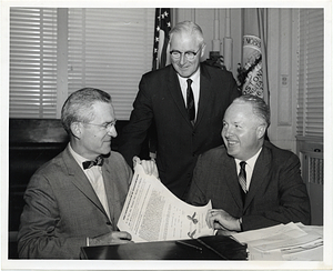 Mayor John F. Collins with Robert S. Kretschmar, Executive Secretary of AAA's Massachusetts Division; and Commissioner Thomas F. Carty of the Boston Traffic Department