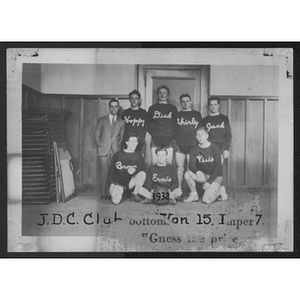 Group portrait of young men's "J.D.C. Club" basketball team wearing sweaters with their names