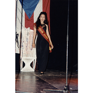 Yaritza Gonzalez wears a Jayuya sash as she walks on stage at the 1996 Festival Puertorriqueño