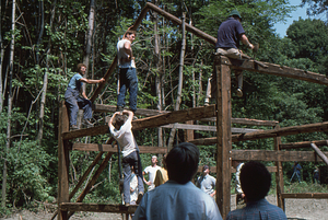First rafters on south end of barn at the Moon Barn Raising at entrance to Hopkins Forest on 2 August 1975.