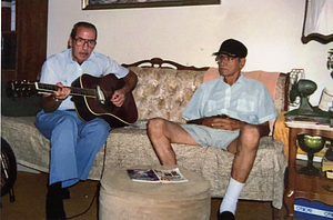 Manny and Joe Oliveira, practicing on couch