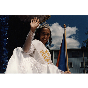 Yaritza Gonzalez, Miss Festival Puertorriqueño, waves from the parade float
