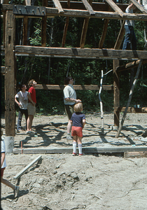 Andrew Art (boy in red shorts and blue shirt with back to camera) at the Moon Barn Raising at entrance to Hopkins Forest on 2 August 1975.