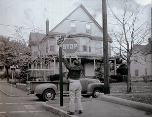 Removing political signs on Clinton St. 1960