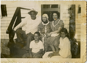 Members of Rose and Naro families on stairs