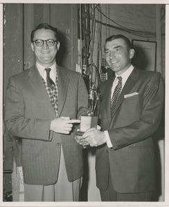 Ed Furgol receiving a trophy from unidentified ICD representative