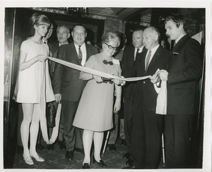 Woman cutting ribbon at national conference on rehabilitation