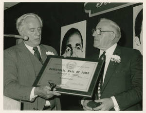 Dr. Edward Steitz receiving his certificate of Election from the Basketball Hall of Fame
