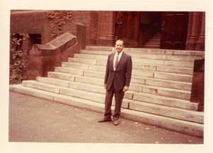 Attallah Kidess standing in front of stairs