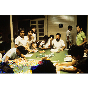 Group of adults working around a table