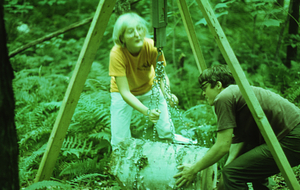 Meg Lowman (Class of 1976) and Thomas Kalt (Amherst College) weighing paper birch log in Paper Birch Biomass and Productivity study.