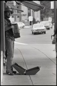 Street musician with accordion, Main Street near City Hall, Northampton, Mass.