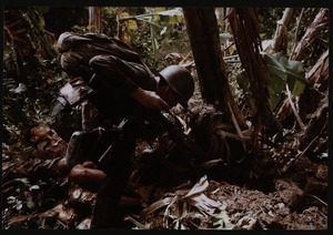 ARVN soldier approaches underground tunnel