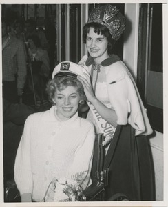 Peggy Colucci receives captain's hat from Georgette Lesch