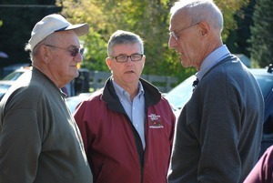 Congressman John W. Olver talking with two men, one wearing a USDA Farm Service Agency for Massachusetts jacket