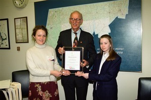 Ingrid Bauer and unidentified woman, National Youth Leaders Conference, presenting Congressman John W. Olver with a plaque for serving on the Honorary Congressional Board of Advisors