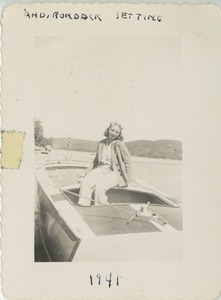 Bernice Kahn seated on a boat in the Adirondacks