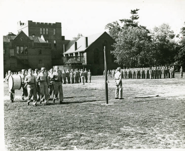 Soldiers marching behind Judd Gymnasia (July 1943)