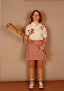 Mary Beth Hughes holding a Lacross stick