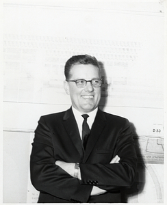 Unidentified man in front of sketch of City Hall