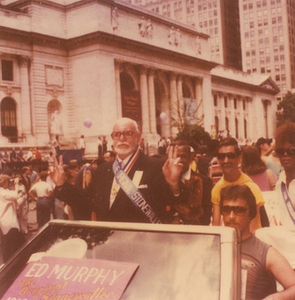 A Photograph of Marsha P. Johnson Behind Ed Murphy in a Car at the 1985 Christopher Street Liberation Day Parade