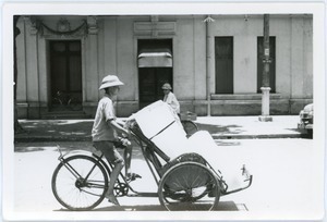 Man cycling with load in pedicab