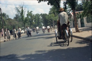 Street scene full of cyclists