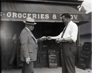 Clarence Jenkins, sharing a cigarette in front of a grocery store