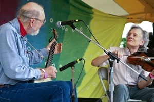 Pete Seeger (banjo) and Mike Seeger (fiddle), performing on stage at the Clearwater Festival