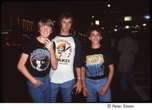 MUSE concert and rally: young men wearing Bruce Springsteen and Yes t-shirts outside MUSE concert