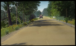 Automobile driving on a country road