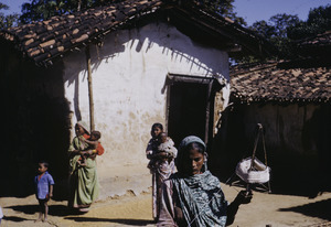 A woman winding thread in a village in Delhi