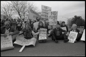 Protests against U.S. intervention in Nicaragua at Westover Air Force base: protesters seated on the pavement, including Frances Crowe (far right)