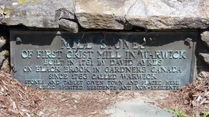 Warwick Free Public Library: plaque marking the millstones from the first grist mill in Warwick