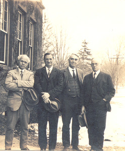 Fred Sears, John Phelan, C. Henry Thompson, and Frank A. Waugh standing in front of building