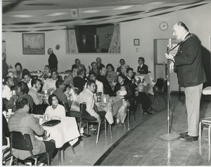 Performer and audience at Thanksgiving dinner