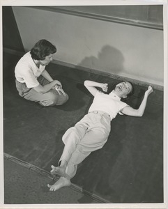 Physical therapist with a young patient